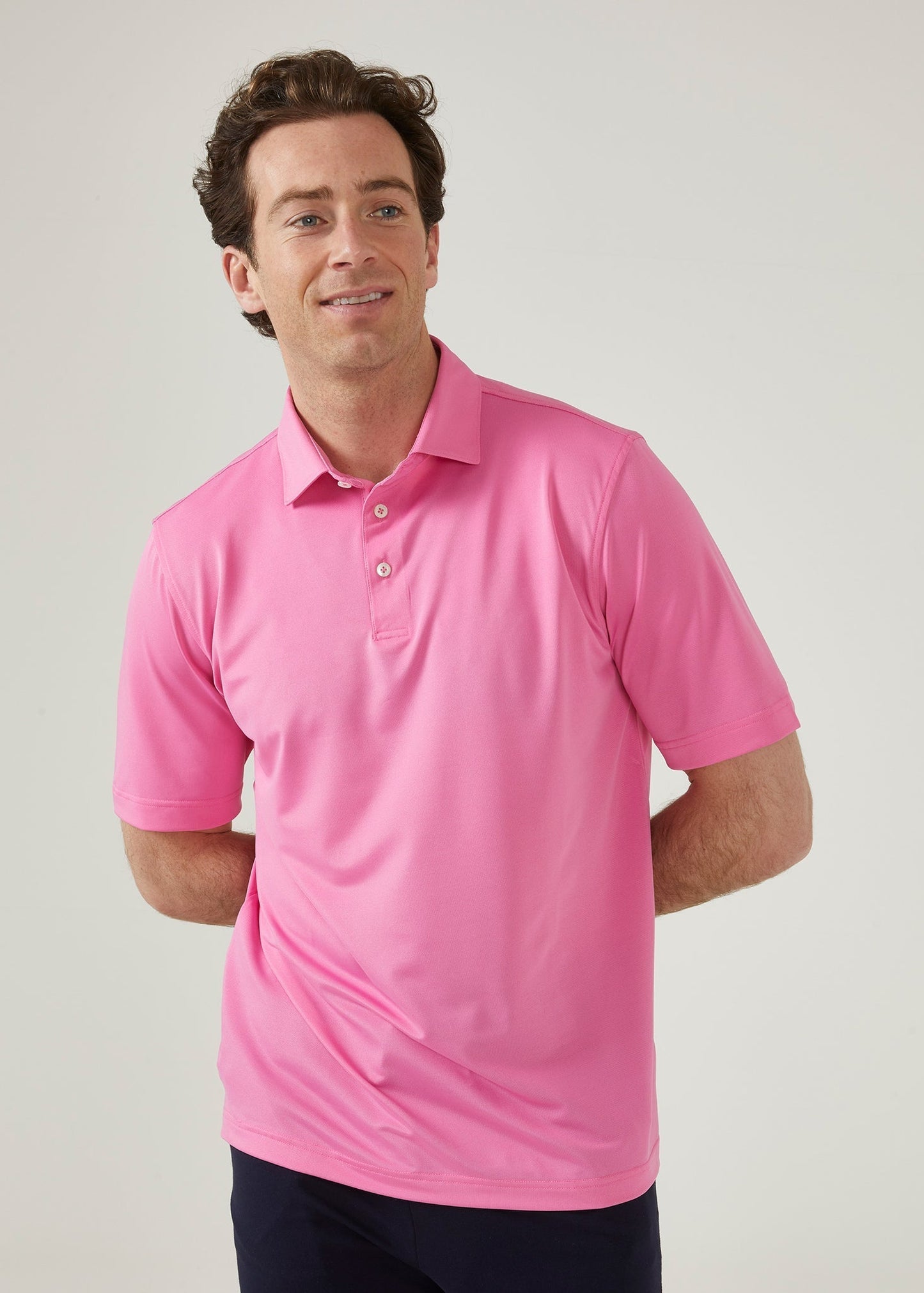 Men's 3 button polo shirt in carnation pink.