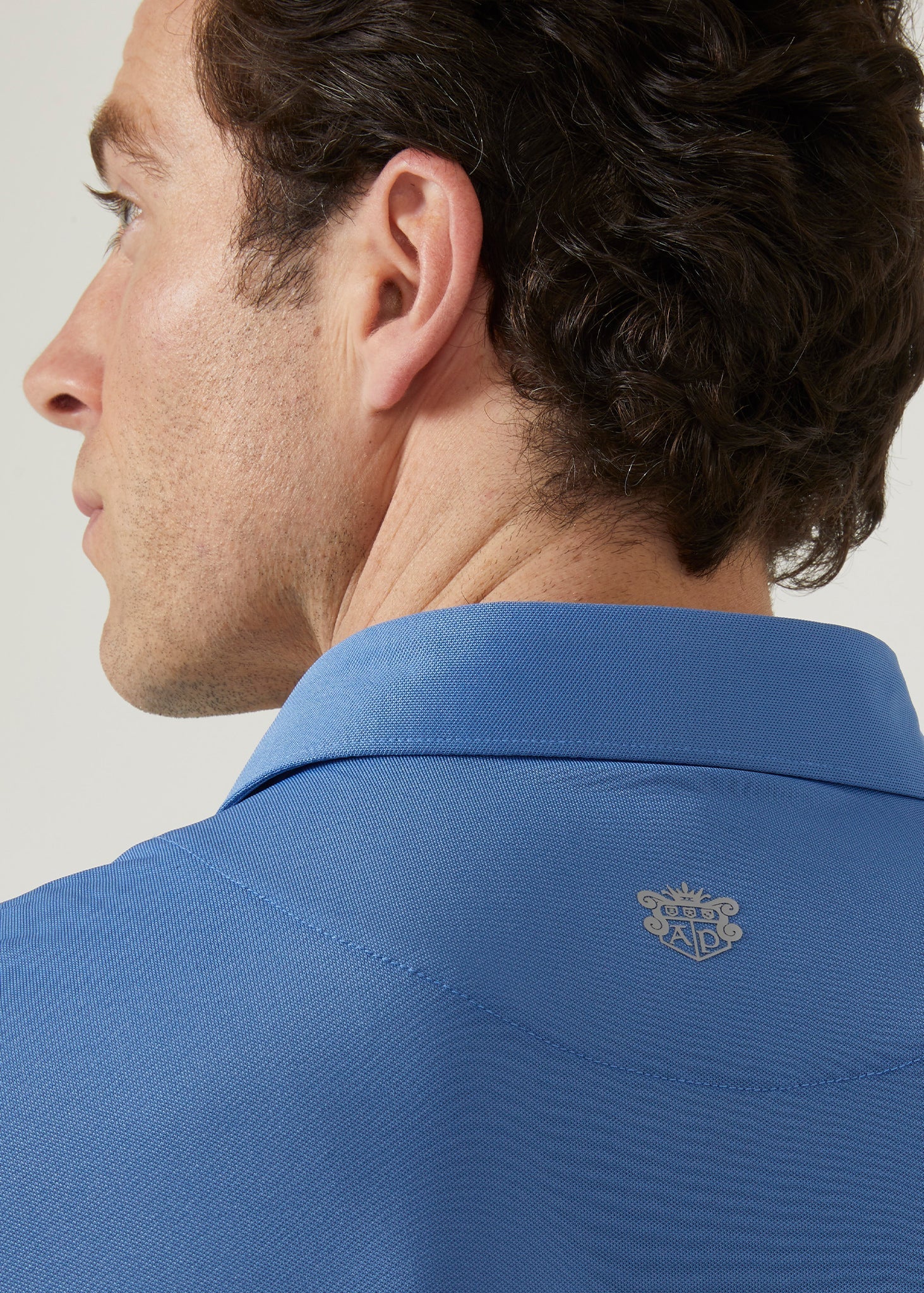 Men's 3 button polo shirt in mid blue.