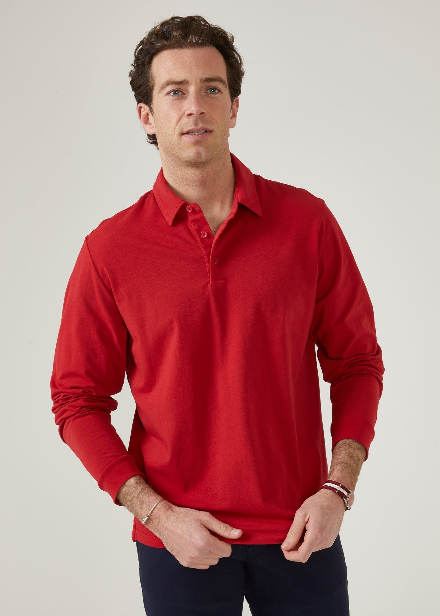 Faded dye polo shirt in rosso red made from a cotton/ spandex blend.